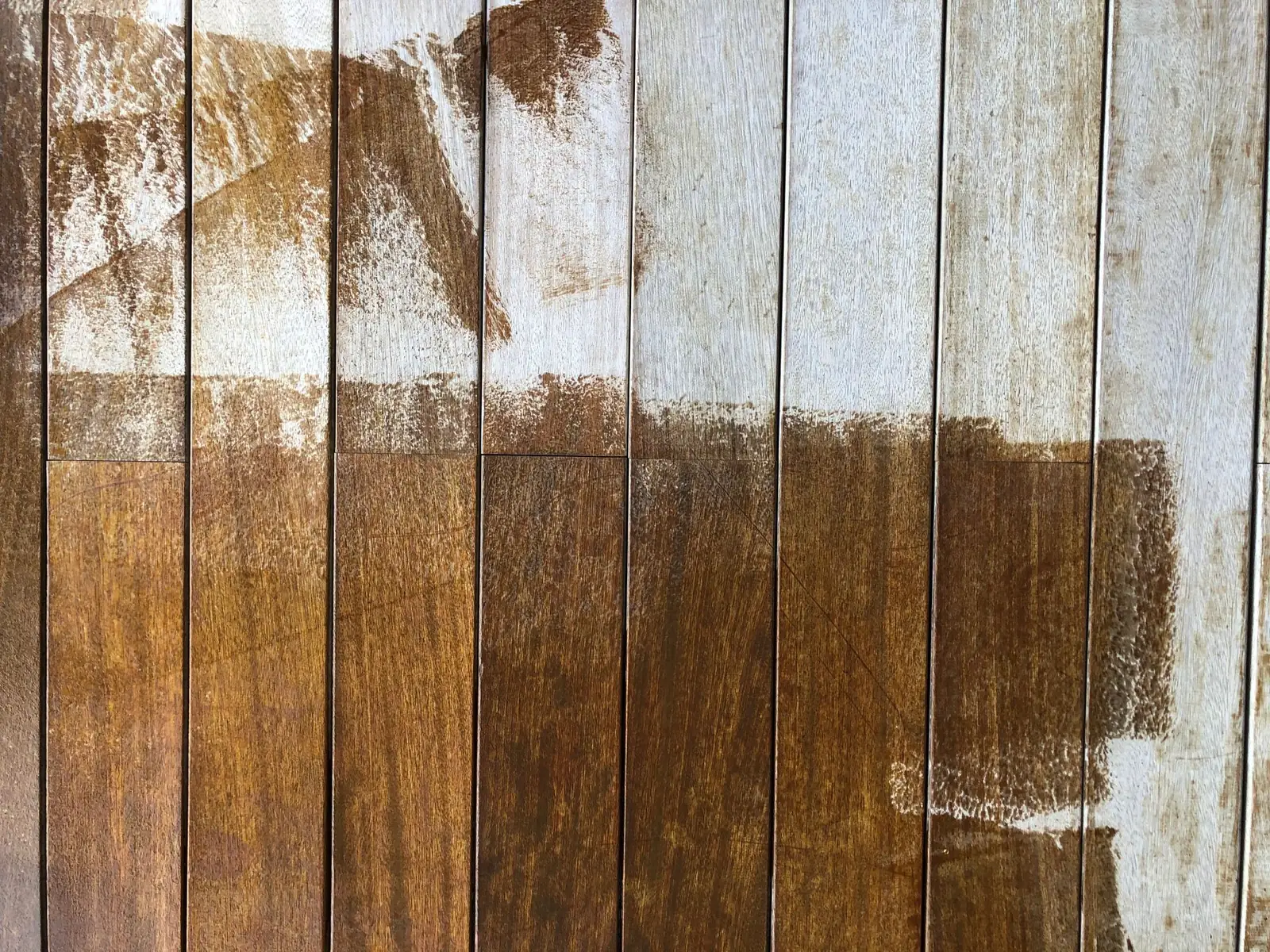 Wood boards half stained showing before and after