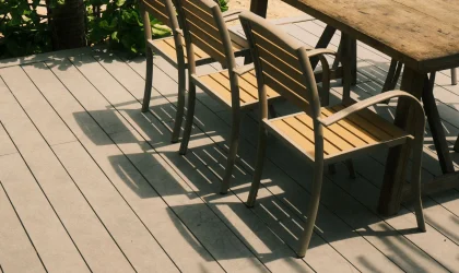 Outdoor chairs and table on a sunny wood deck