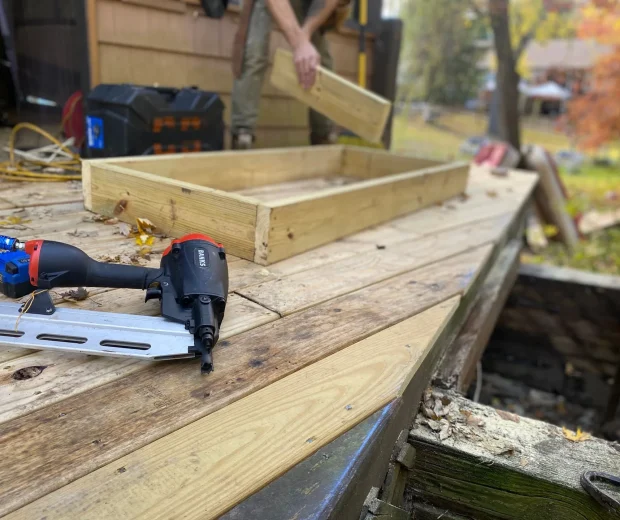 New deck boards being fastened with a nail gun