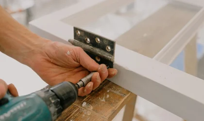 Drilling a hinge onto a door frame